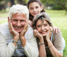 Family smiling at the camera